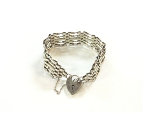 A silver gate bracelet weighing 17.36g. Postage A.