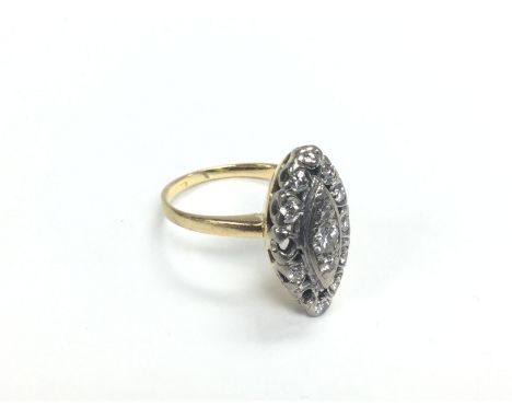 An 18ct gold oval diamond cluster ring, two stones missing, approx 7.5g and approx size O. Shipping category A.