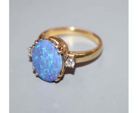 An opal and diamond three-stone dress ring, 18ct yellow gold setting and shank, size O/P.