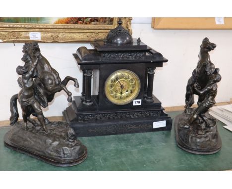 A Victorian black slate mantel clock and a pair of spelter Marly horses