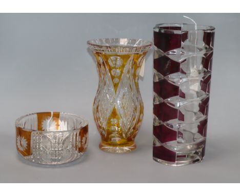 A French ruby overlay faceted glass vase, stamped 'France' to base and two other items, a yellow overlay faceted and cut glas