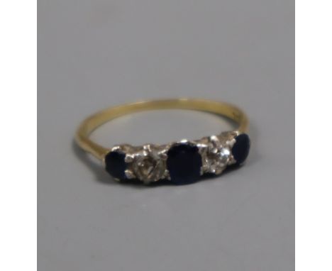 An 18ct, graduated sapphire and diamond five stone half hoop ring, size P.