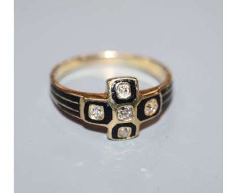 A 19th century yellow metal, black enamel and old cut diamond set mourning ring, size P.