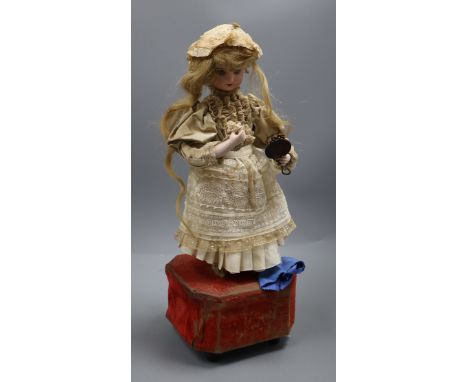 A Roullet et Decamps 'lady with powder puff and mirror' automaton with a closed mouth Jumeau head, with brown glass eyes, pie