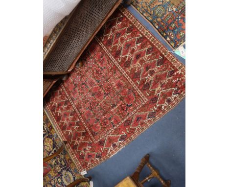 A North West Persian red ground carpet 300 x 140cm