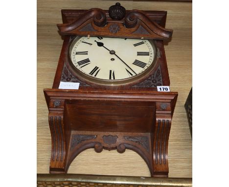 A fusee carved wall clock