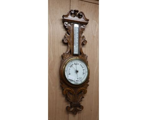A late Victorian oak barometer / thermometer H.86cm