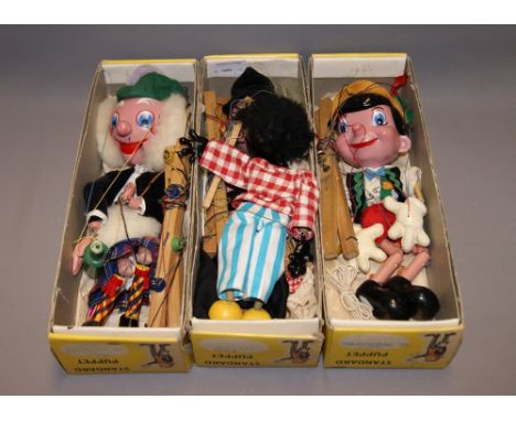Three boxed Pelham Puppets "Pinocchio", "Witch" and "Mac Boozle" plus an unboxed vintage 'Golly' puppet  CONDITION REPORT; Al