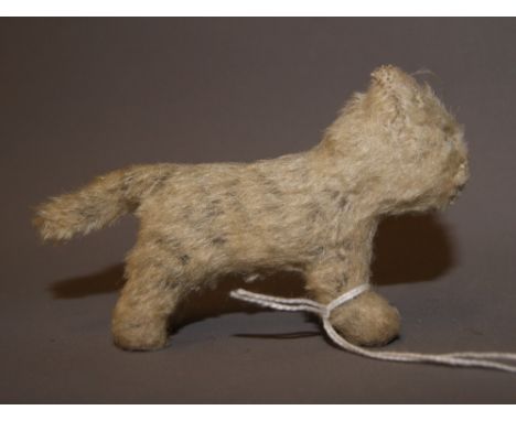 A miniature Steiff tiger CONDITION REPORT; Steiff button present in the right ear. Length approximately 125mm. Overall slight