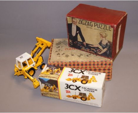 Two vintage boxed jigsaw puzzles and a Diecast model JCB, along with a boxed Chad Valley Mah-Jong set 