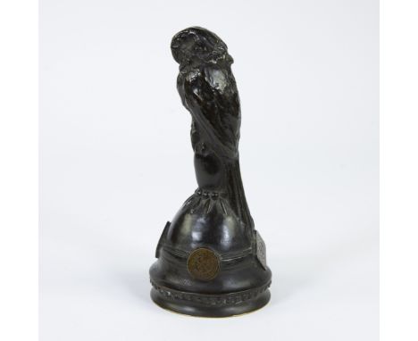 Domien INGELS (1881-1946), bronze parrot on a bell surrounded by WWI Ghent coins, signedDomien INGELS (1881-1946), bronzen pa