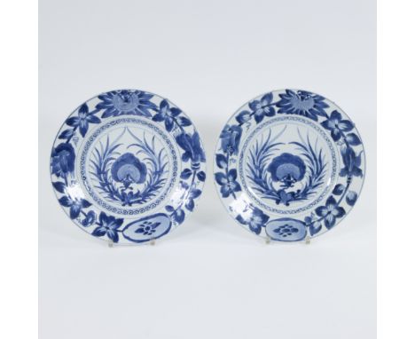 Pair of porcelain dishes decorated in underglaze blue with centrail precious vase within a foliate wreath., the wide rim deco