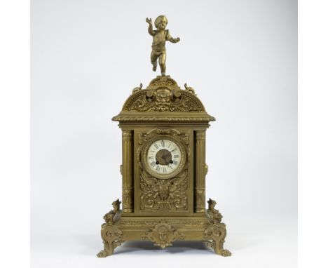A large 19th-century French ormolu mantle clock surmounted by a cherub, decorated with satyr, fabulous animals and children's