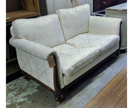 SOFA, 86cm x 160cm x 82cm H, cream damask upholstered with beechwood showframe and brass castors. 