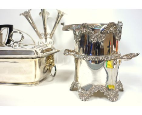 A group of silver plate, tureen with ceramic liner, wine bottle holders, epergne, and tea and coffee set 