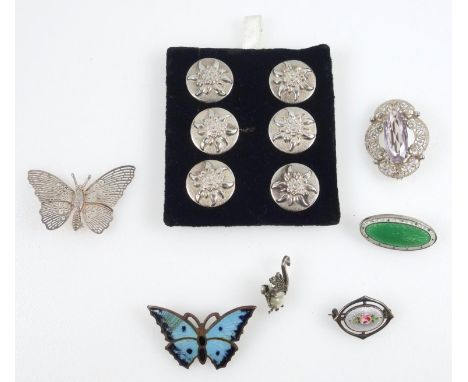 A small group of mainly silver jewellery to include, Charles Horner brooch, another with green enamel, a set of silver button