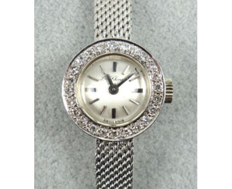 Chopard lady's diamond set watch in white gold with integral bracelet strap, dial signed L U Chopard Geneve, overall length 1