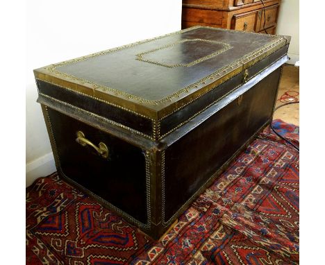 Leather and cedar wood trunk, with brass mounts and studded decoration, 50 x 106 x 54 cm. Provenance: Margaret Bide Collectio
