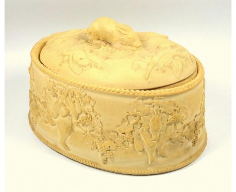 Wedgwood cane ware game pie dish, with rabbit finial and decoration of game and fruiting vine in relief, ceramic liner, impre