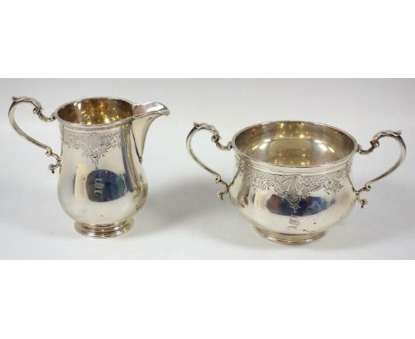 George V silver baluster sugar basin with chased floral, scallop, scroll and lattice decoration, initialled 'S', on a raised 