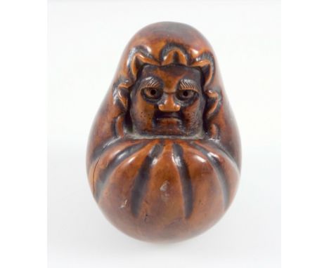 Japanese Daruma figure, carved from a single piece of wood, Meiji  period, 10 cm 