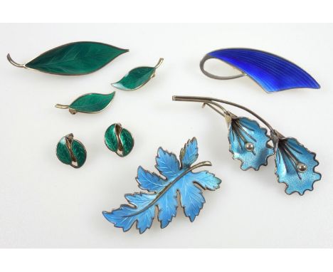 A group of Scandinavian enamel and silver jewellery, including; David Andersen designs, in blue and green enamels, four brooc