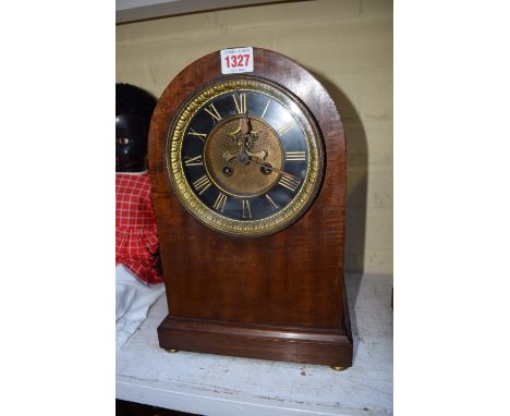 A late Victorian mahogany dome top mantel clock, 34.5cm high. 