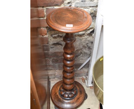 An antique oak or ash pedestal, with graduated bobbin turnings, 75.5cm high. 