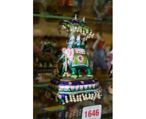 An Eastern white metal and enamel elephant and howdah figure group, with pearl decoration, 17cm high.