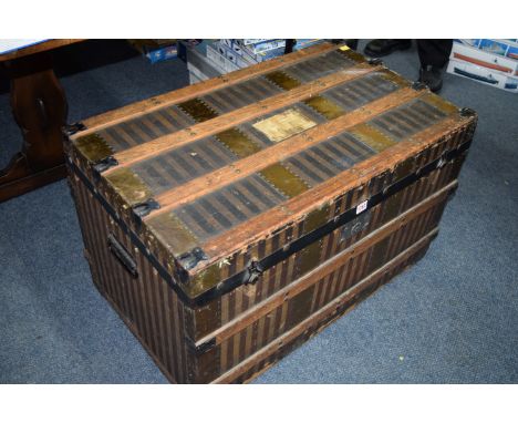 A vintage trunk, with striped canvas fabric, 85cm wide. 