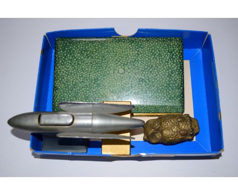 A novelty brass owl vesta case; together with a simulated shagreen cigarette case; a vintage chrome rocket lighter; and a gil