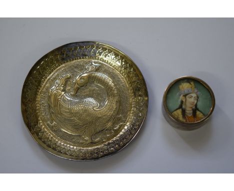 A Eastern metal circular dish, decorated with a stylised bird, 9cm; together with another Eastern metal pill box and cover, t