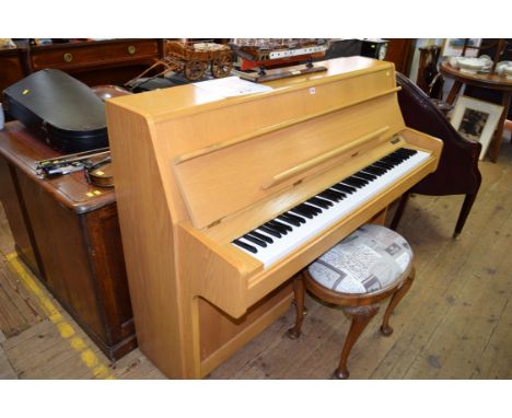 A Kimball pale oak upright piano, Model E427, Serial No: B88129, 144.5cm wide. 