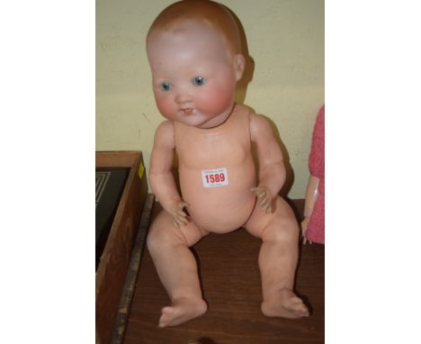 An Armand Marseille baby doll, No.351./6.K. Condition Report: Overall condition is good.  Eyes tilt, teeth intact, minor chip