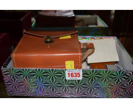 Cameras: a Minox AIII-S miniature camera, serial No.106757, complete with leather case,; flash unit; flash gun, boxed; and ot