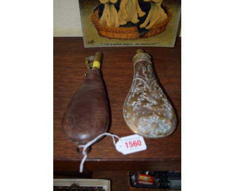 A Victorian copper and brass powder flask, inscribed 'Hawkeley'; together with another leather shot flask.  Condition Report: