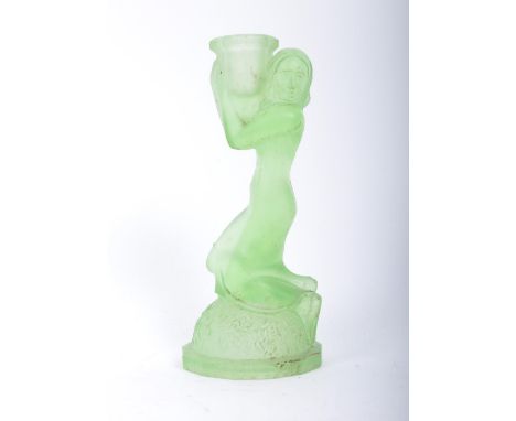 An early 20th century circa 1930s green frosted glass candlestick holder formed as a lady holding the mount upon her shoulder