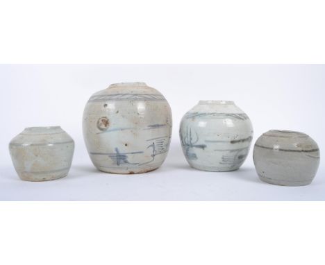 A group of four unlidded 18th century pottery / ceramic ginger jars, each with grey ground and light blue pattern, the larges