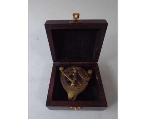 A Wooden Box Containing Small Brass Reproduction Ship's Compass.
