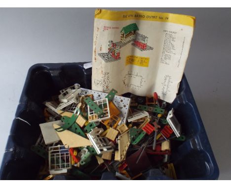 A Box Containing Bayko and Meccano Parts.