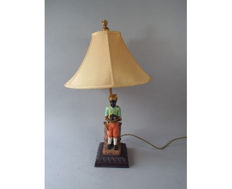 A Blackamoor Table Lamp with Shade.