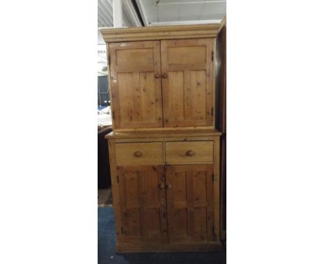 A Pine Kitchen Cabinet with Two Drawers Over Cupboard Base and Raised Shelf Section.