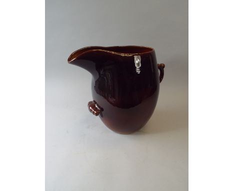 A Large Treacle Glazed Ceramic Jug 34 Cm High. 