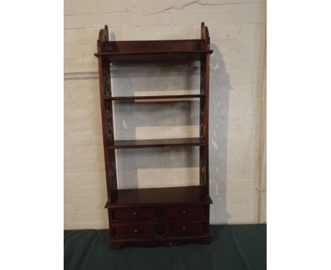 A Four Shelf Whatnot with Pierced Side Supports and Four Small Drawers to Base.
