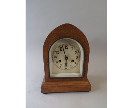 An Edwardian Oak Lancet Mantle Clock 31 Cm High.