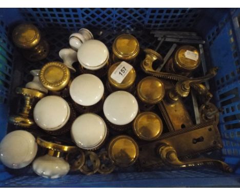 A Collection of Various Brass and Ceramic Door Handles.