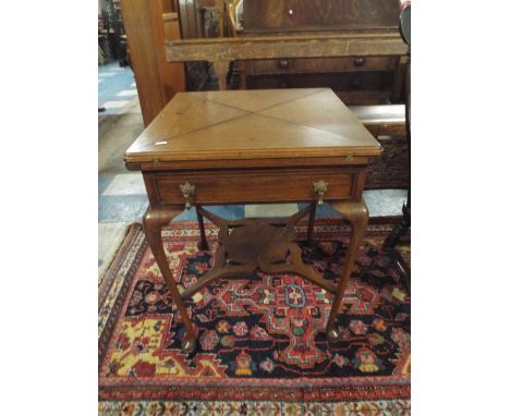 An Edwardian Mahogany Envelope Games Table with Cabriole Legs, Pierced Stretcher and Single Drawer. Baize Playing Surface and