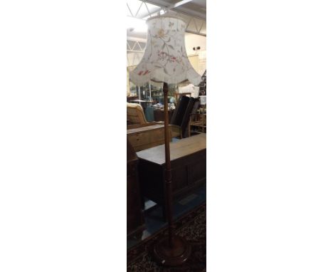 An Edwardian Turned Oak Standard Lamp and Shade.