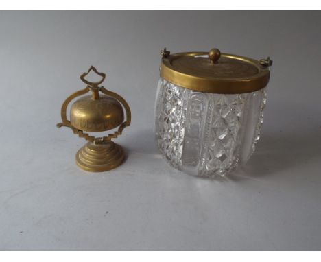 A Brass Mounted Glass Biscuit Barrel and A Brass Desk Bell.