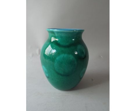 A Poole Pottery Green Glazed Vase.